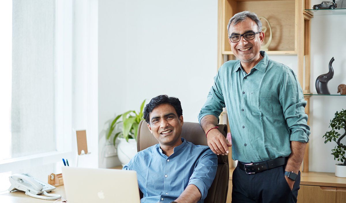 Zero Designs team members interacting in an office space