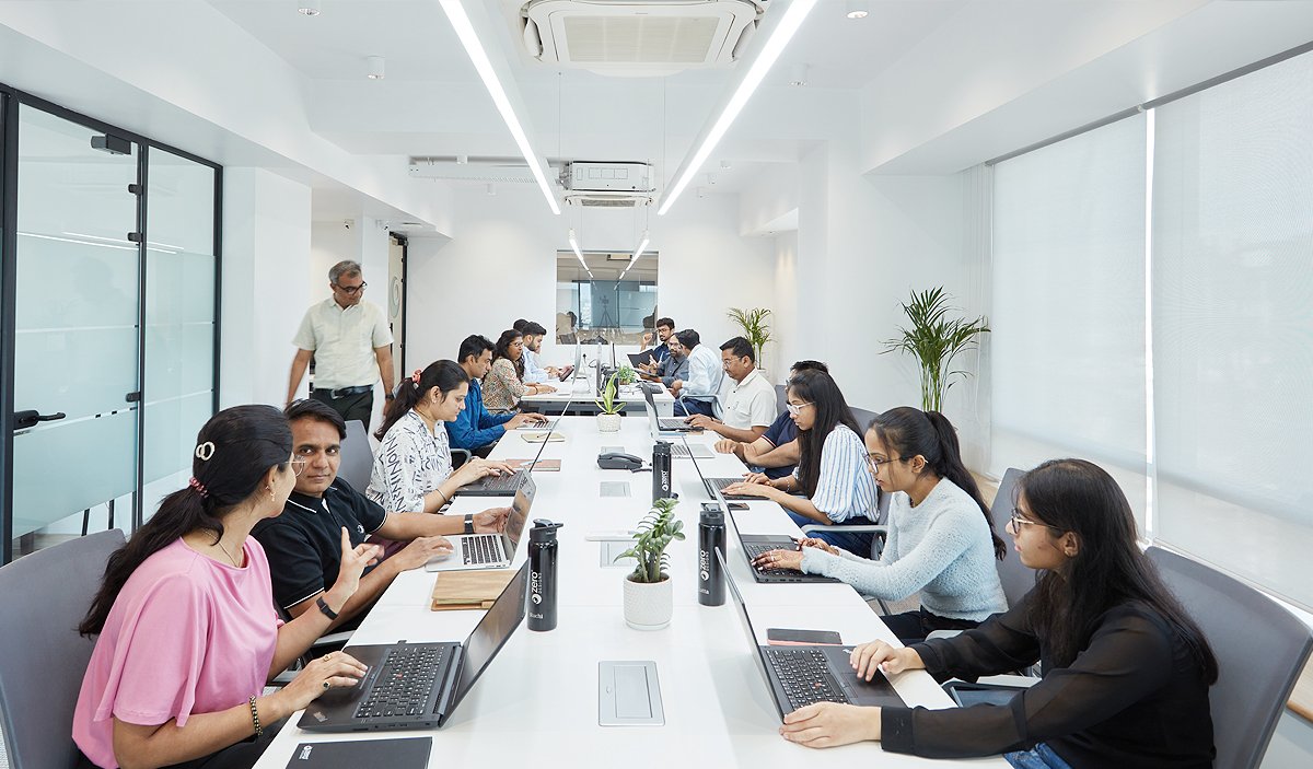 Zero Designs team members interacting in an office space