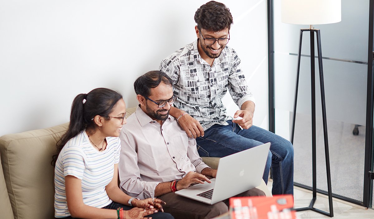 Zero Designs team members interacting in an office space