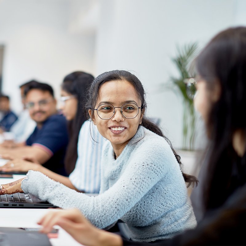 Zero Designs team members interacting in an office space