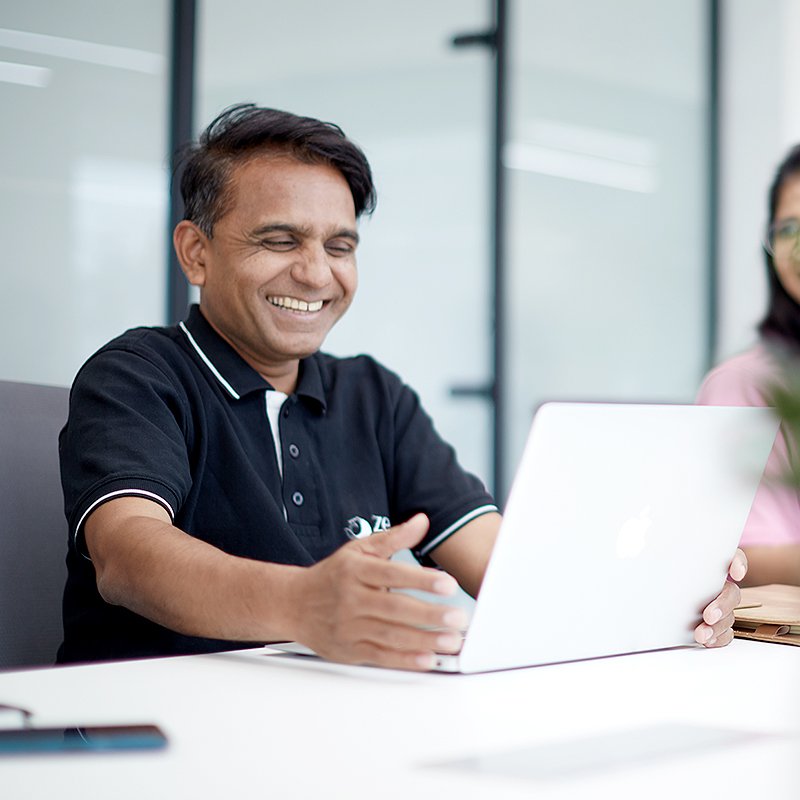 zero designs team members working in office space