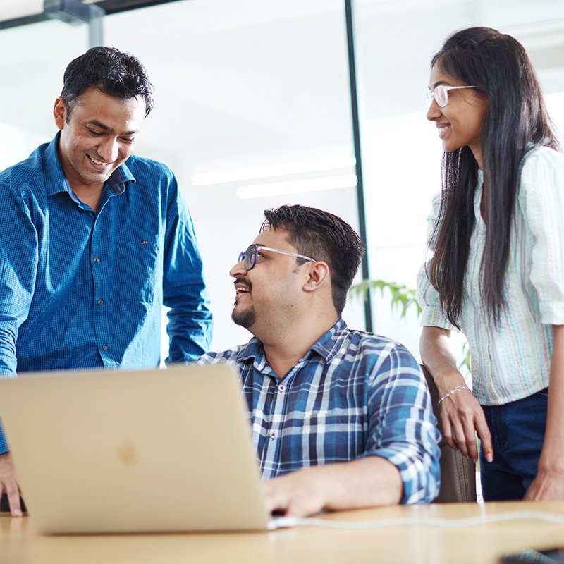 Zero Designs team members interacting in an office space