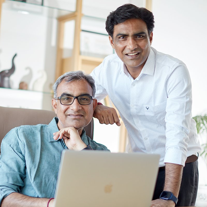 Zero Designs team members interacting in an office space