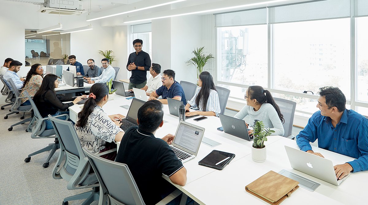Zero Designs all team members interacting in an office space