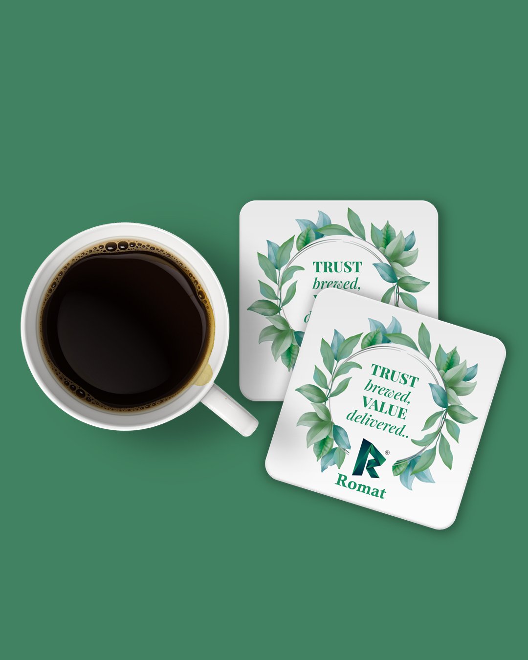 Coffee cup and Romat-branded coasters with leaf design